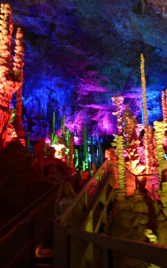 Aven Armand cave on the Causse Méjean. Illuminated stalagmites.